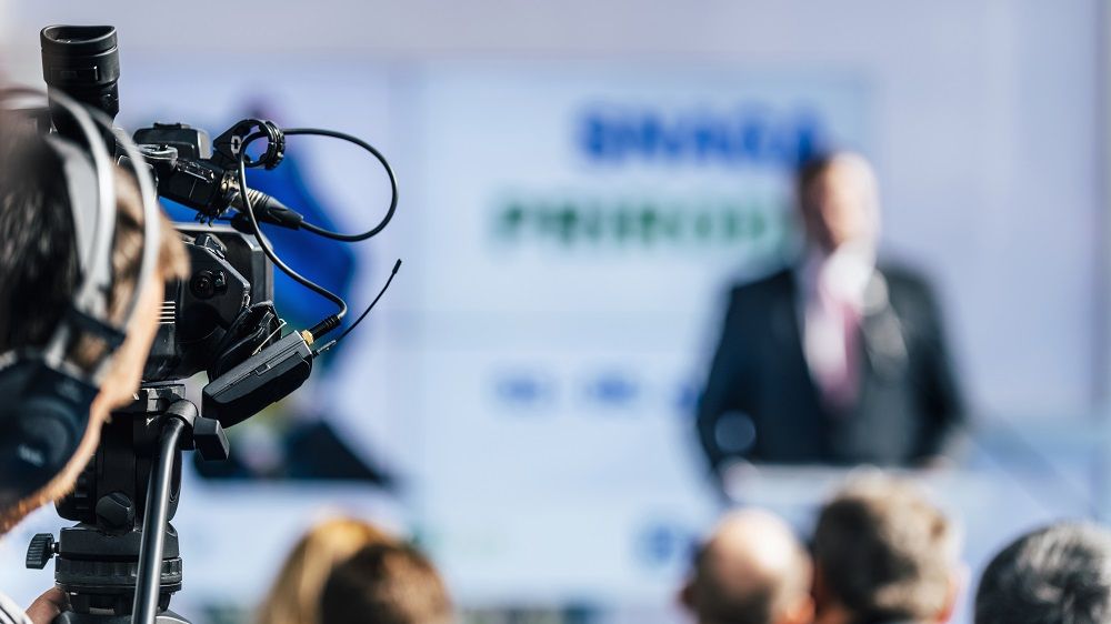 media-event-cameraman-with-headphones-recording-DTBW7K8.jpg