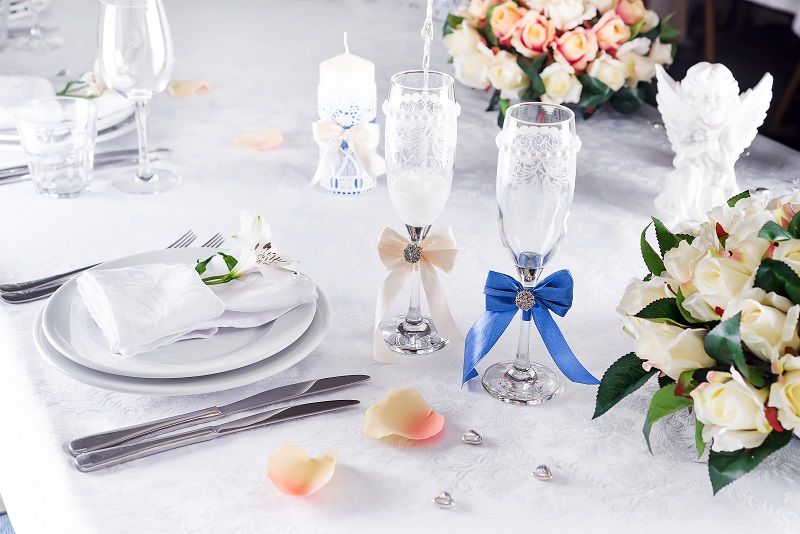 plate-at-the-wedding-table-with-glass-on-white-FTMYHZD.jpg