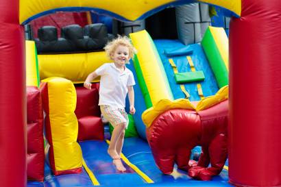 bigstock-Child-Jumping-On-Playground-Tr-222360238.jpg