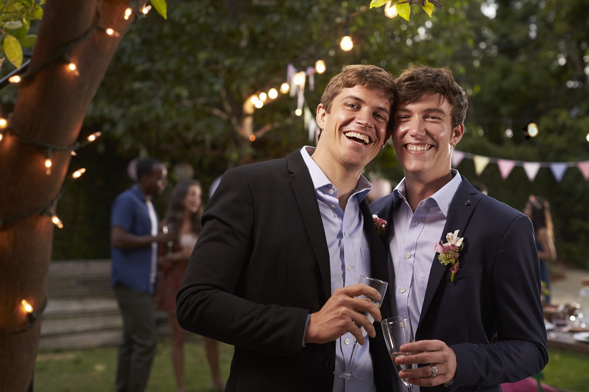 gay-couple-celebrating-wedding-with-party-in-PF6WEG_20190925-123613_1.jpg